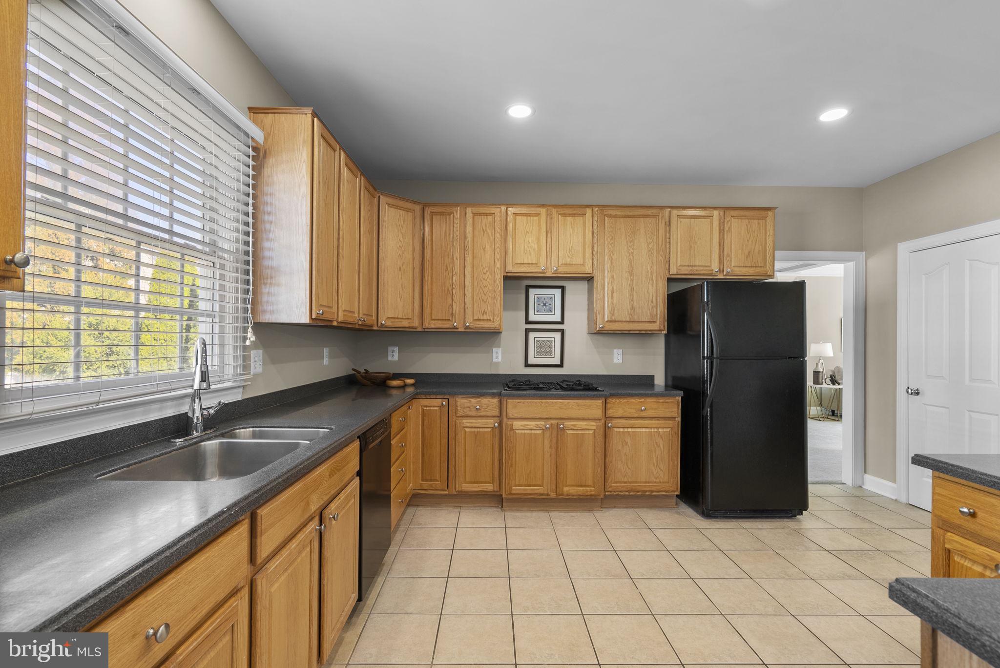 14421 Ashleigh Greene Road Boyds, MD 20841 - Photo 18 of 95 Huge Kitchen with Breakfast Bar Island