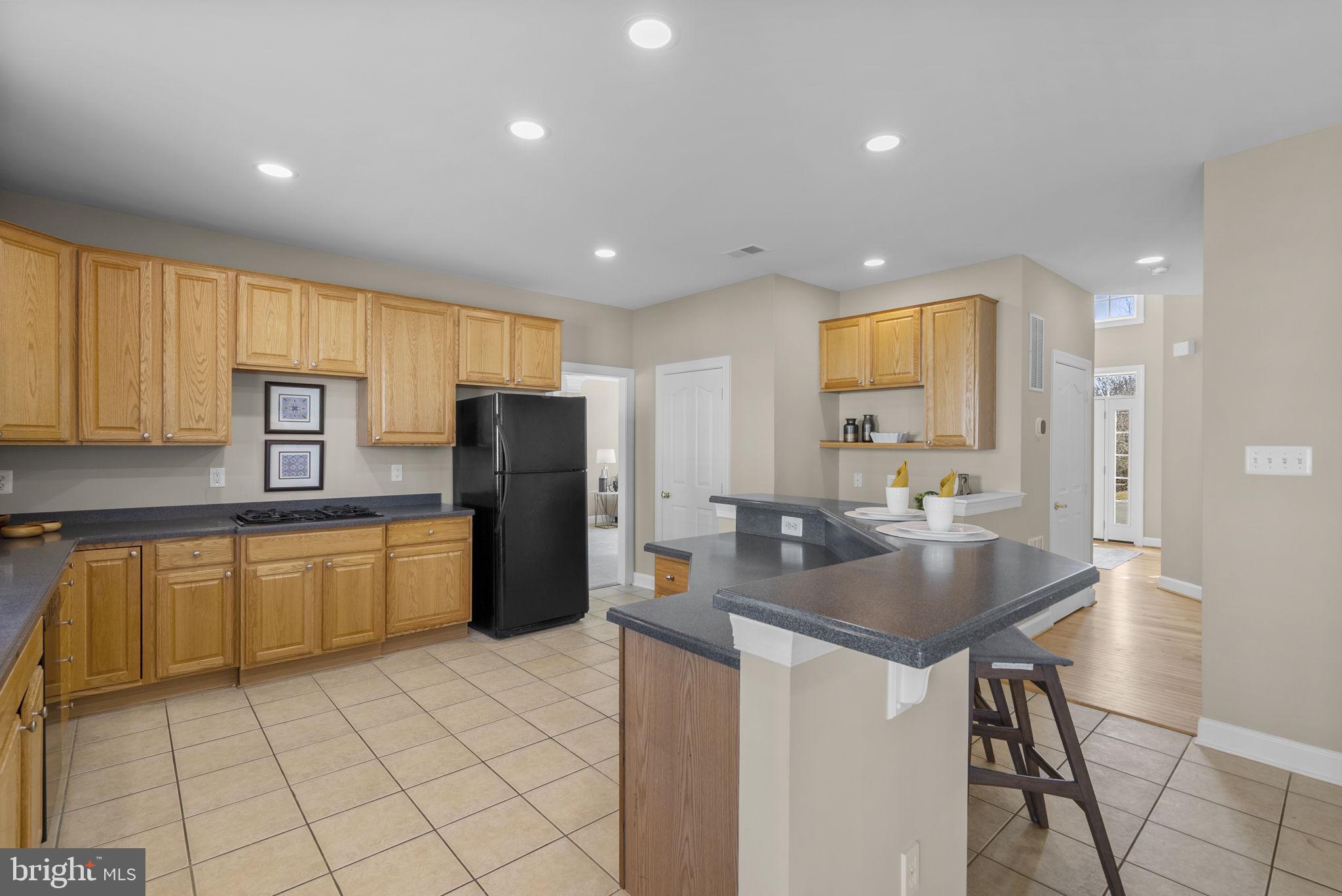 14421 Ashleigh Greene Road Boyds, MD 20841 - Photo 19 of 95 Huge Kitchen with Breakfast Bar Island