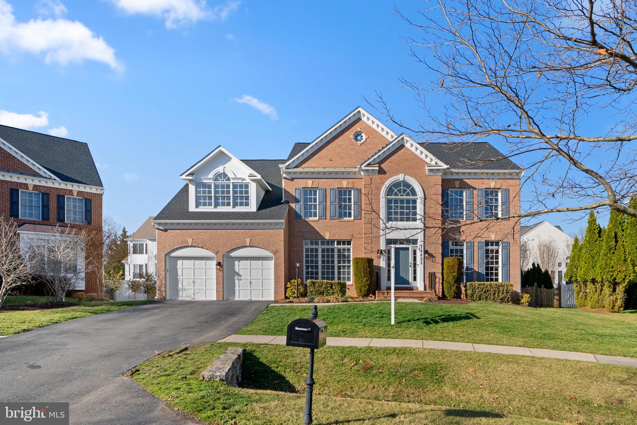 14421 Ashleigh Greene Road Boyds, MD 20841 - Photo 2 of 95 a front view of a house with a yard
