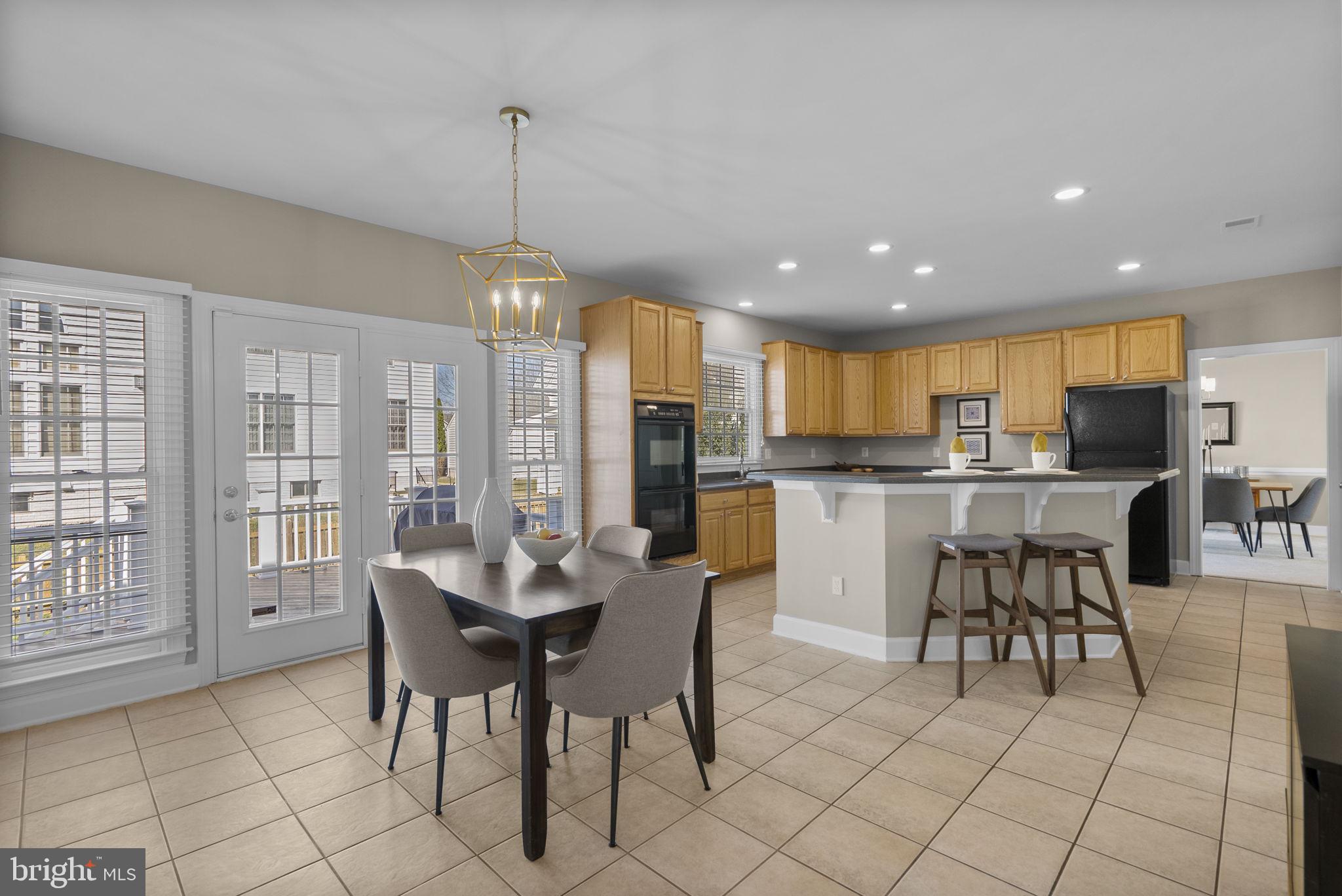 14421 Ashleigh Greene Road Boyds, MD 20841 - Photo 23 of 95 Kitchen Table Space with direct access to the Deck