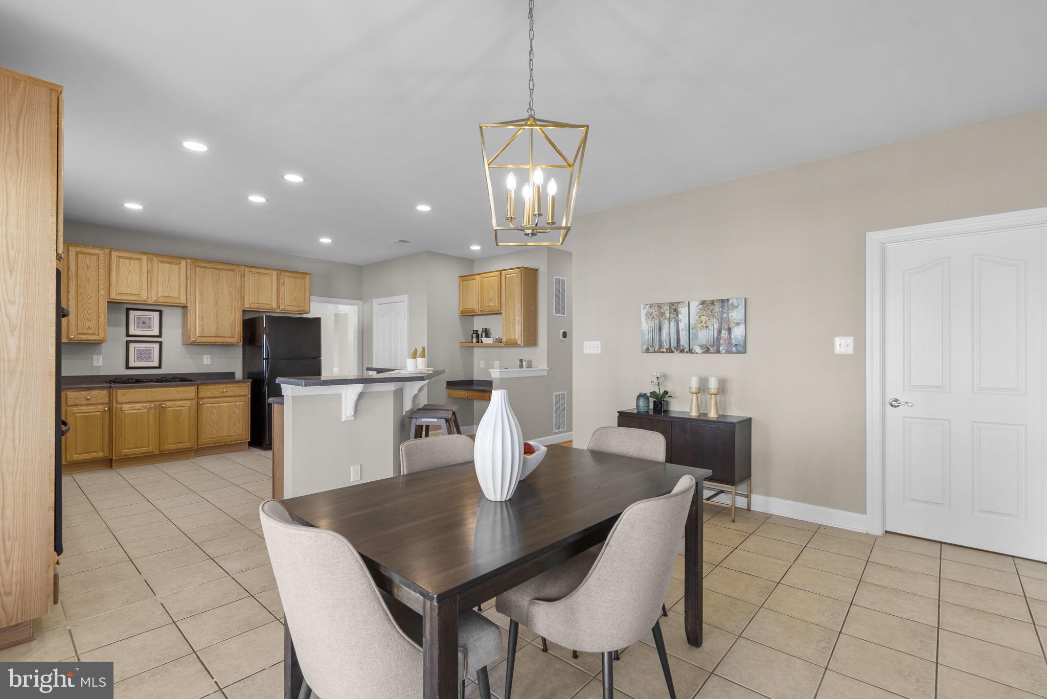 14421 Ashleigh Greene Road Boyds, MD 20841 - Photo 24 of 95 a view of a dining room with furniture