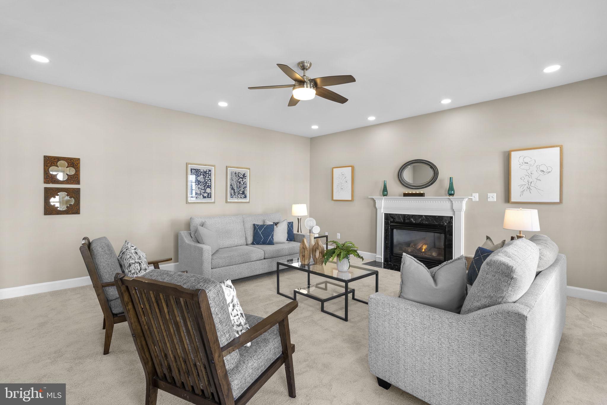14421 Ashleigh Greene Road Boyds, MD 20841 - Photo 25 of 95 a living room with furniture a fireplace