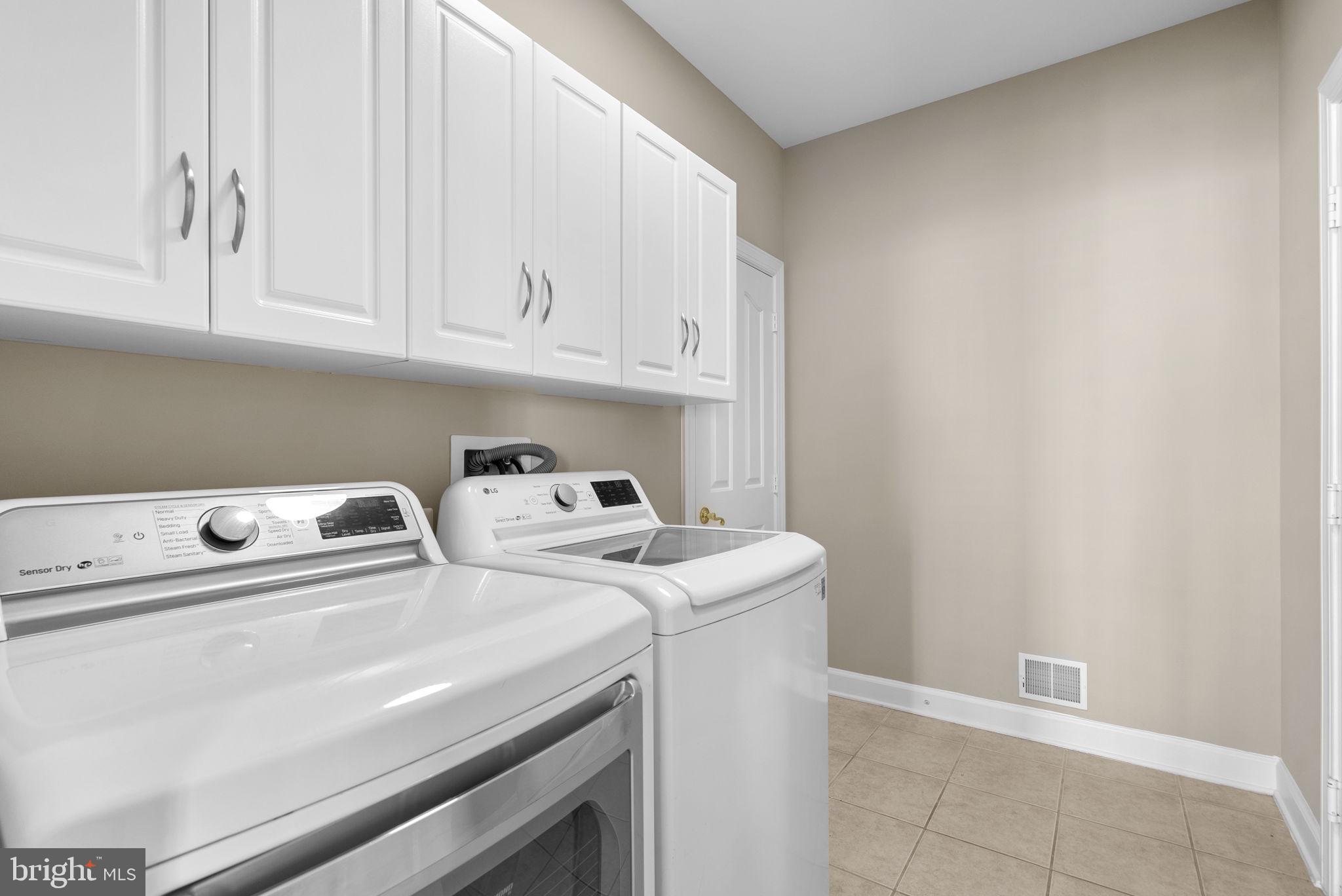 14421 Ashleigh Greene Road Boyds, MD 20841 - Photo 30 of 95 a utility room with dryer and washer