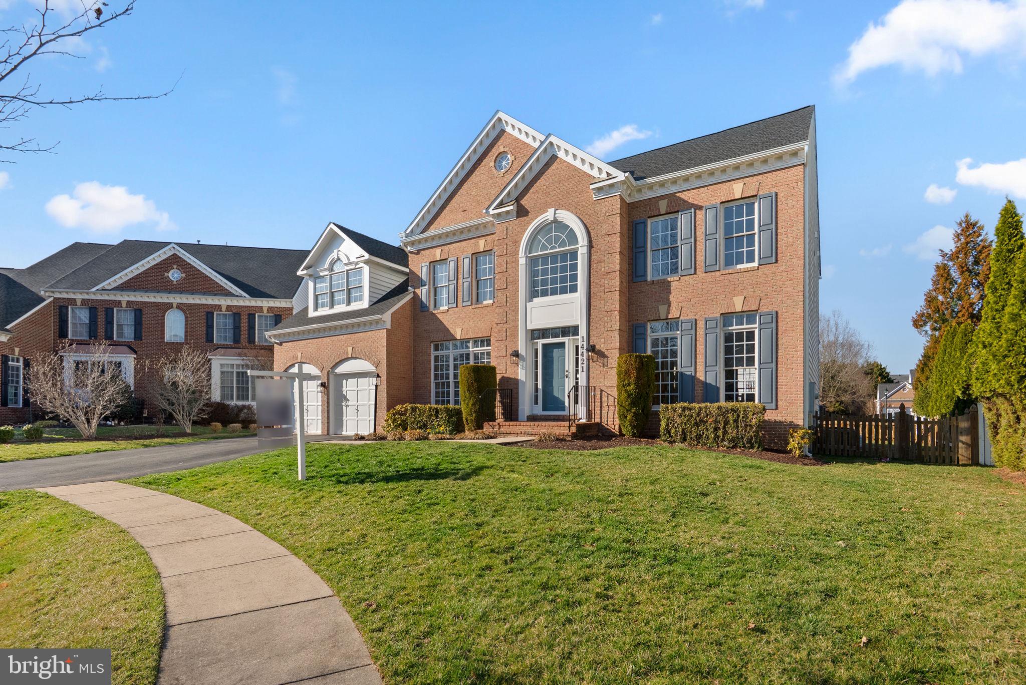 14421 Ashleigh Greene Road Boyds, MD 20841 - Photo 3 of 95 a front view of a house with a yard