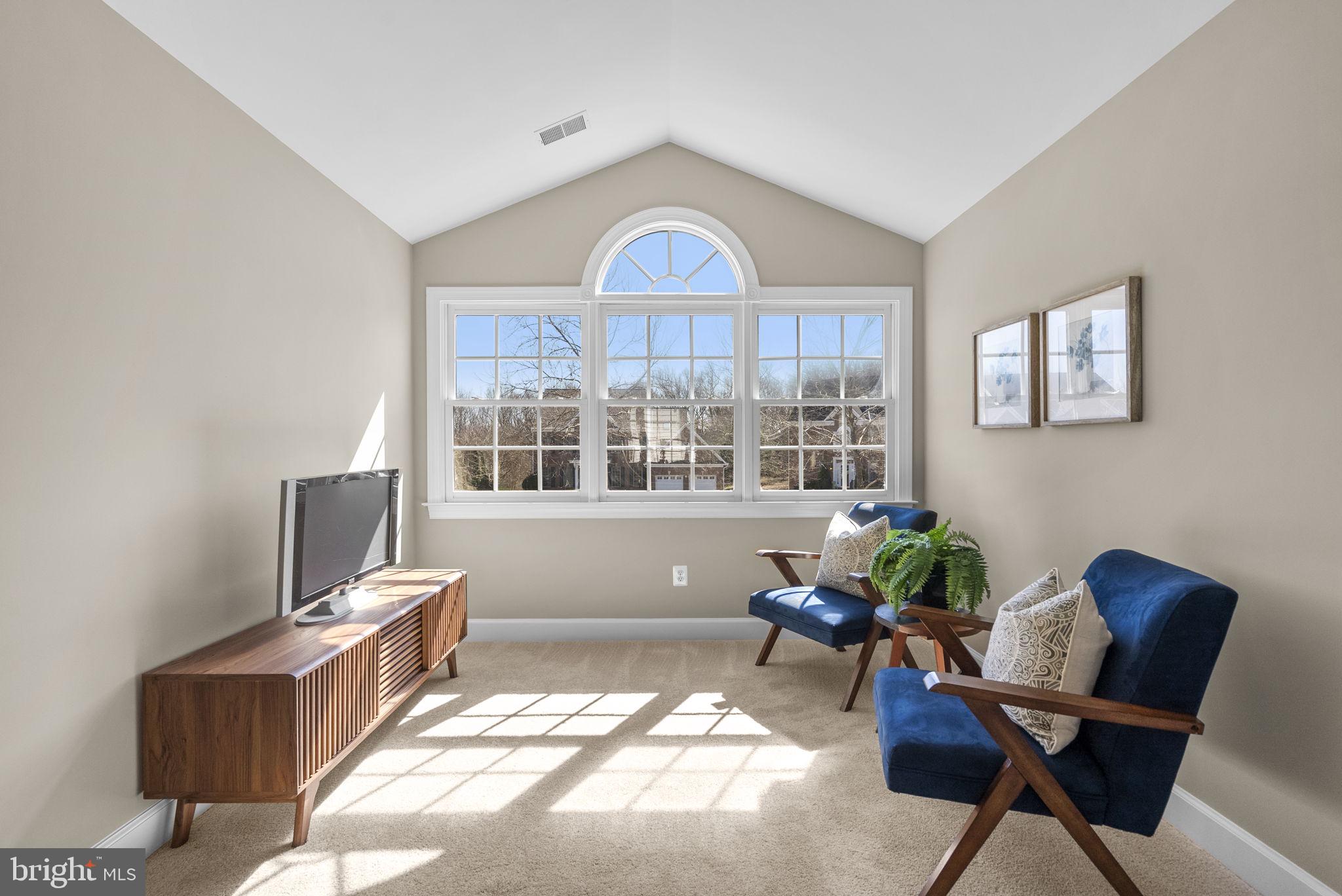 14421 Ashleigh Greene Road Boyds, MD 20841 - Photo 39 of 95 a living room with furniture and a window