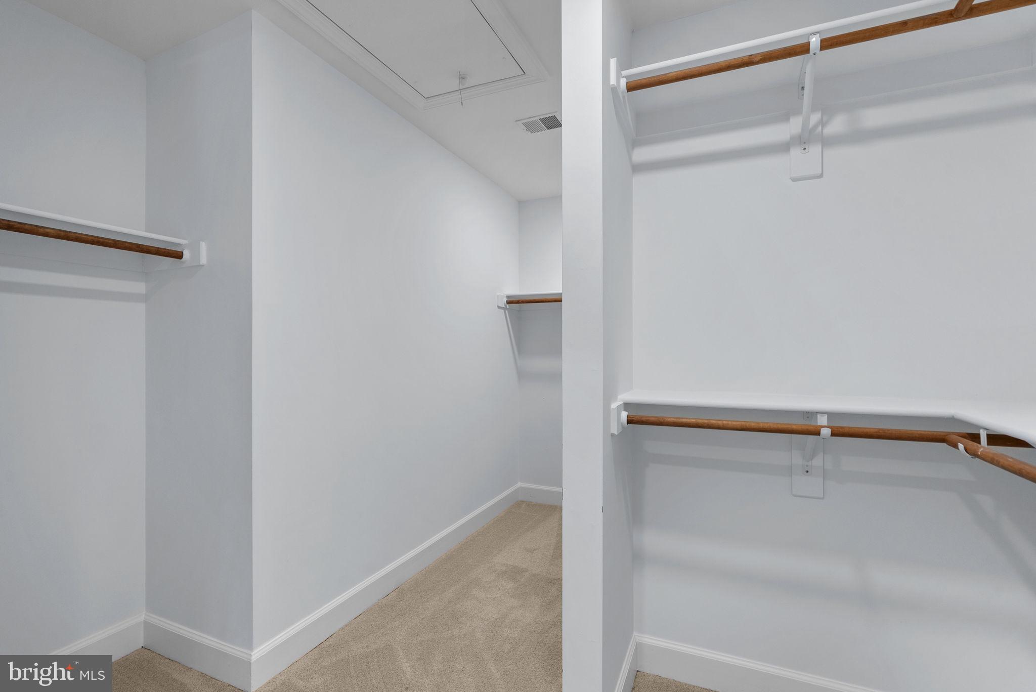 14421 Ashleigh Greene Road Boyds, MD 20841 - Photo 42 of 95 a view of walk in closet with empty racks