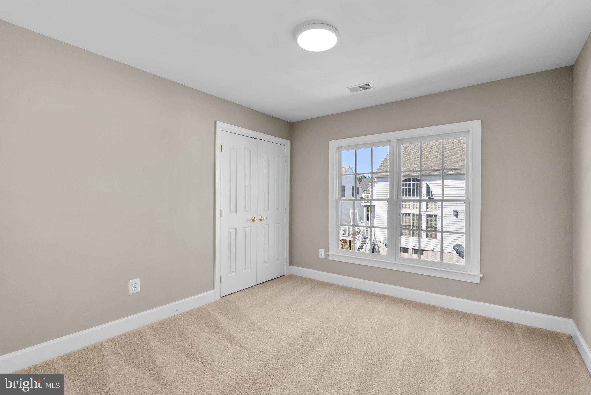 14421 Ashleigh Greene Road Boyds, MD 20841 - Photo 43 of 95 a view of an empty room with a window