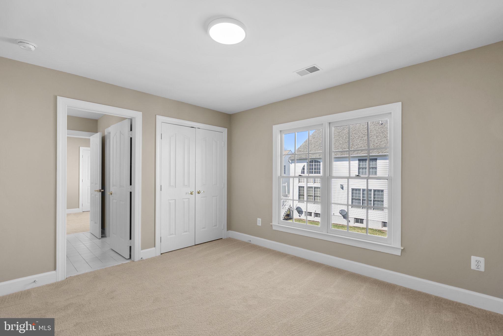 14421 Ashleigh Greene Road Boyds, MD 20841 - Photo 49 of 95 a view of an empty room with a window