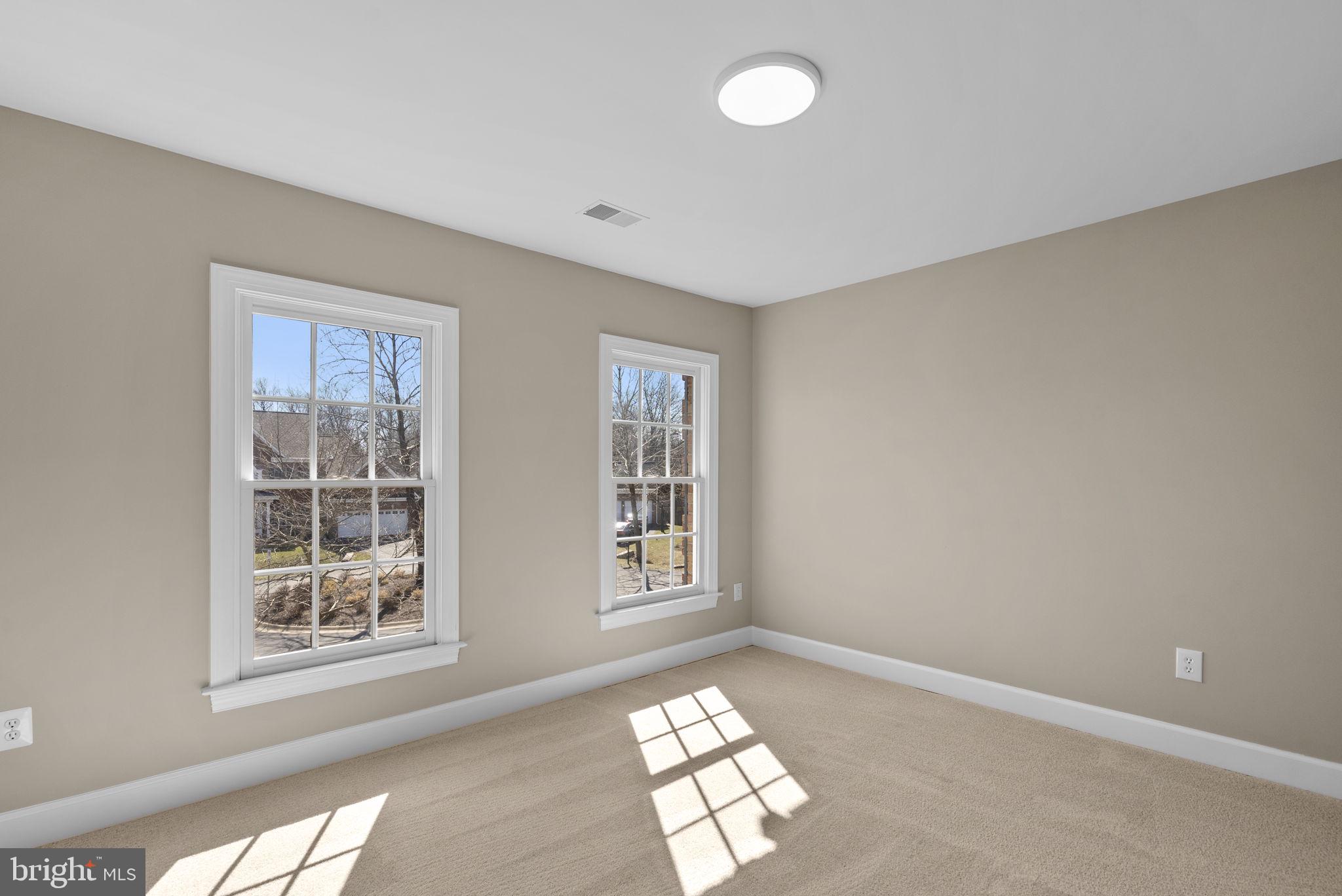 14421 Ashleigh Greene Road Boyds, MD 20841 - Photo 52 of 95 a view of an empty room with windows
