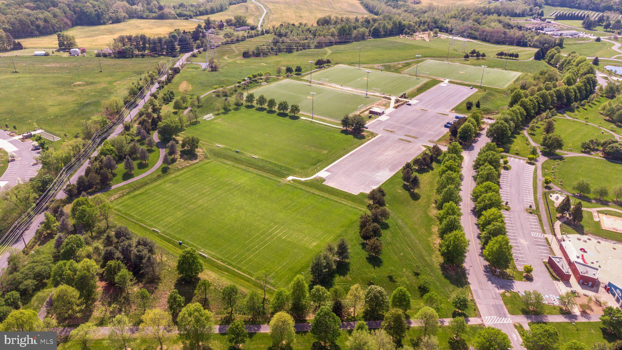 14421 Ashleigh Greene Road Boyds, MD 20841 - Photo 84 of 95 an aerial view of residential houses with outdoor space