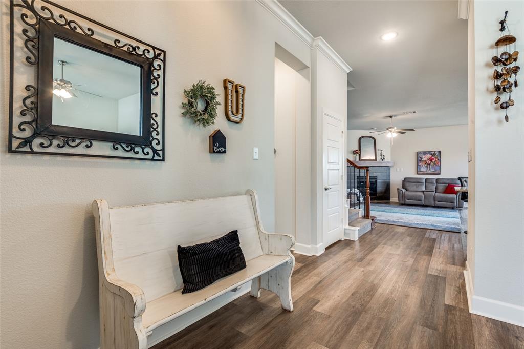 4724 Raspberry Spar Court Arlington, TX 76005 - Photo 6 of 40 a living room with a couch and a flat screen tv