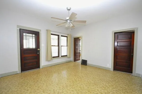 a view of an empty room with a window