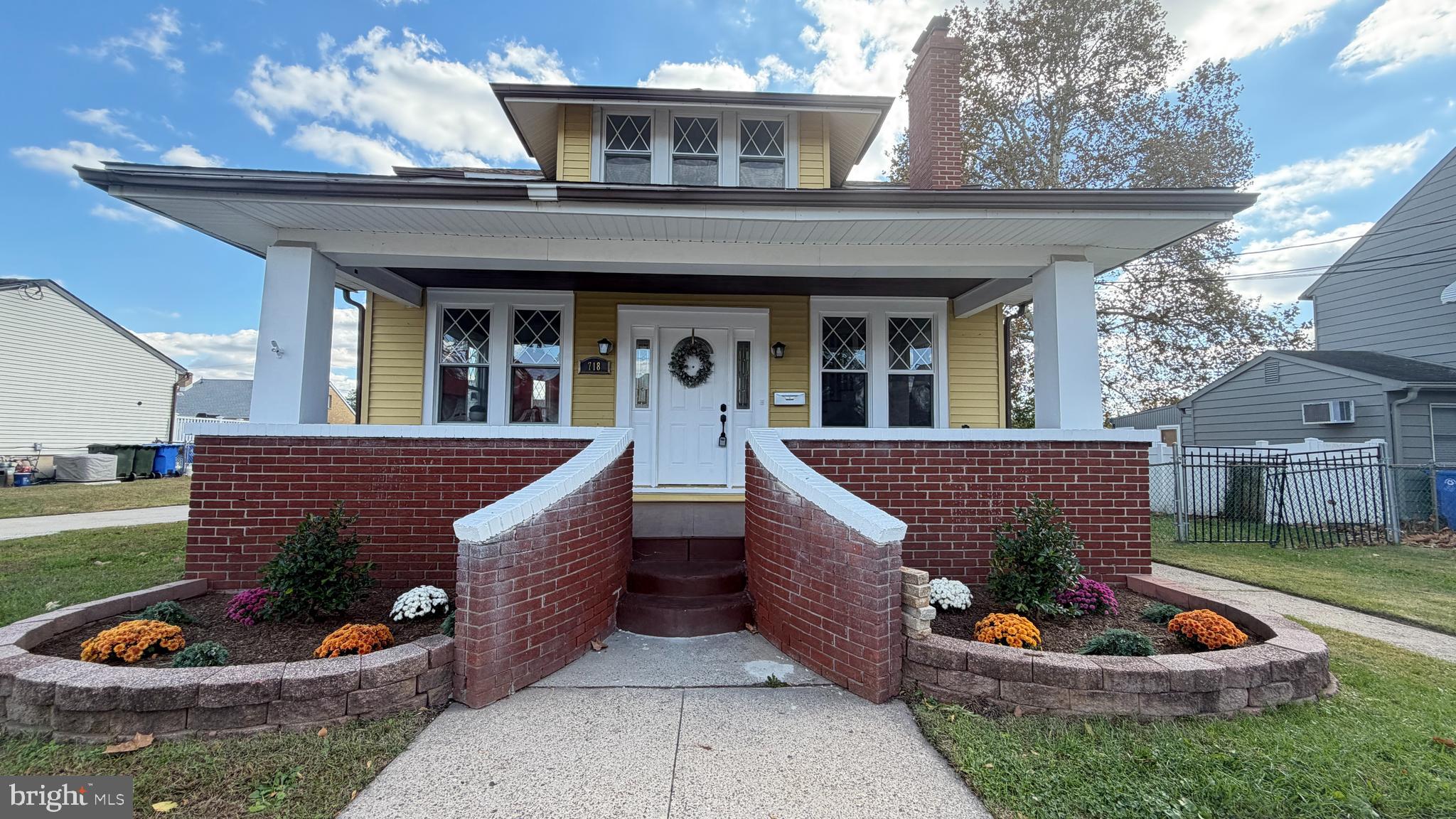 a view of a patio with chair and potted plants
