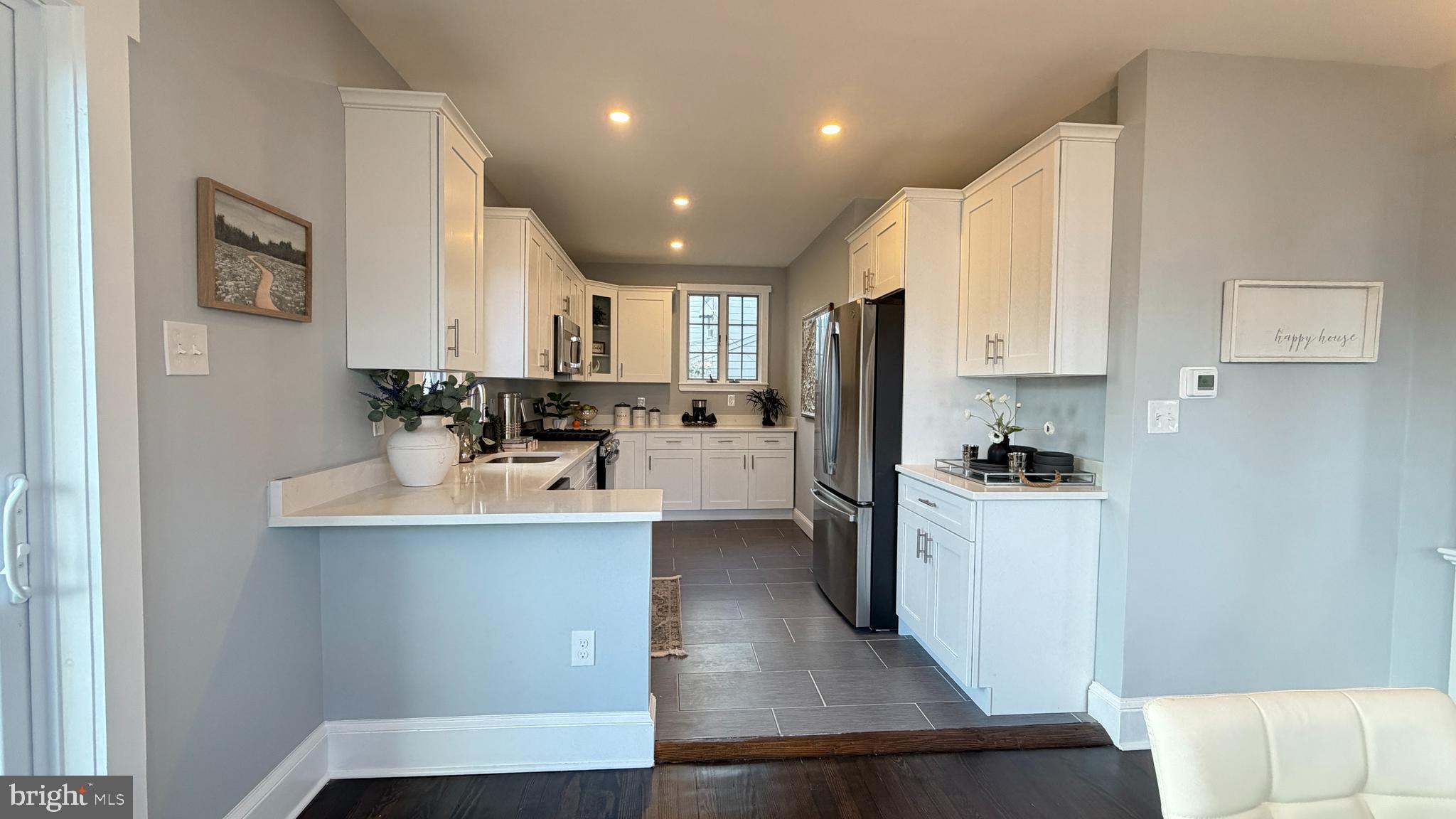 718 Bordentown Road Burlington, NJ 08016 - Photo 12 of 30 a kitchen with white cabinets and stainless steel appliances