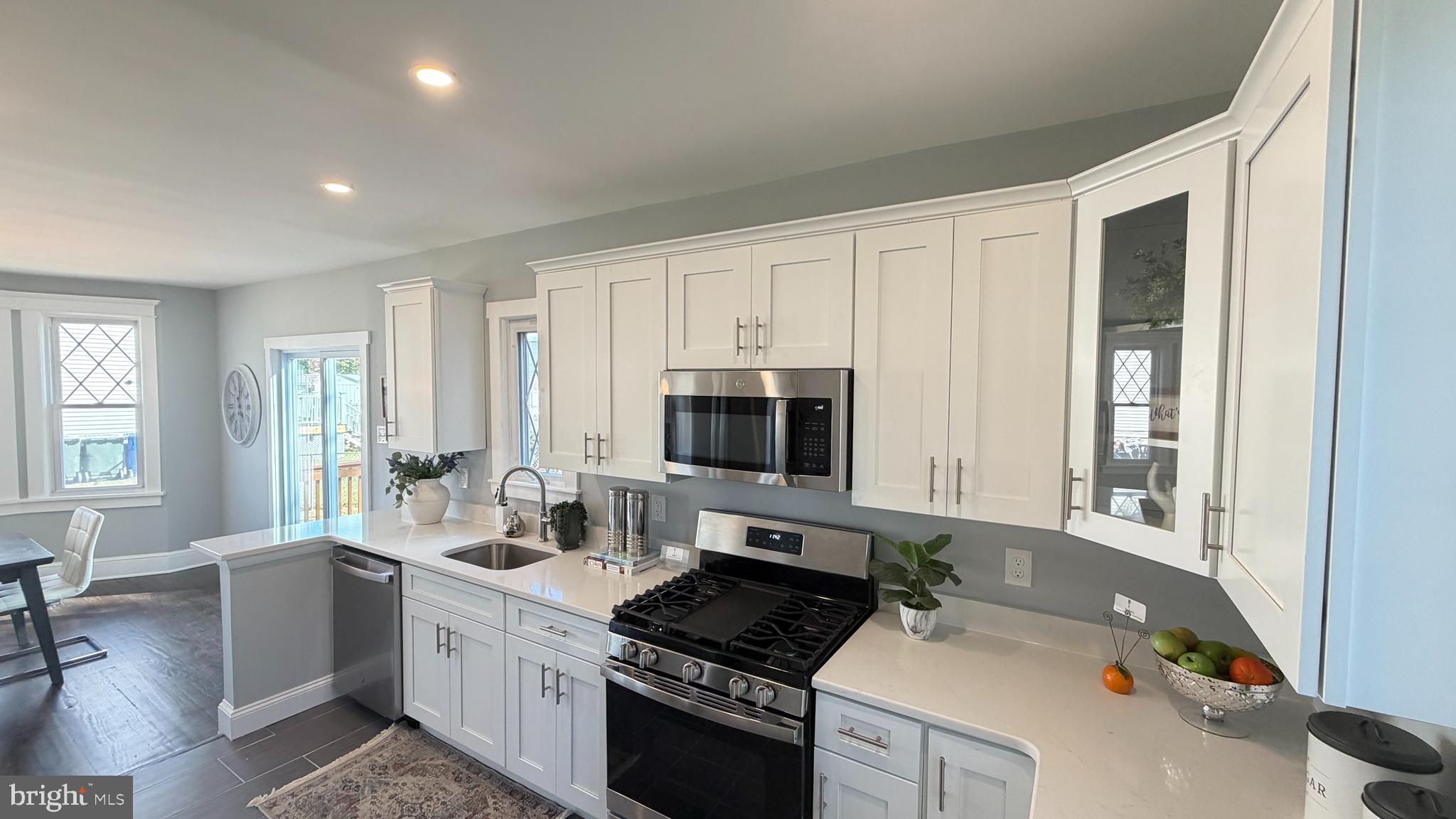 718 Bordentown Road Burlington, NJ 08016 - Photo 14 of 30 a kitchen with a stove a sink and a microwave