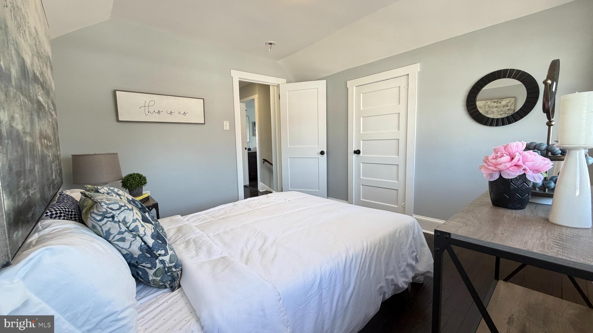 718 Bordentown Road Burlington, NJ 08016 - Photo 19 of 30 a bedroom with a bed and a chandelier