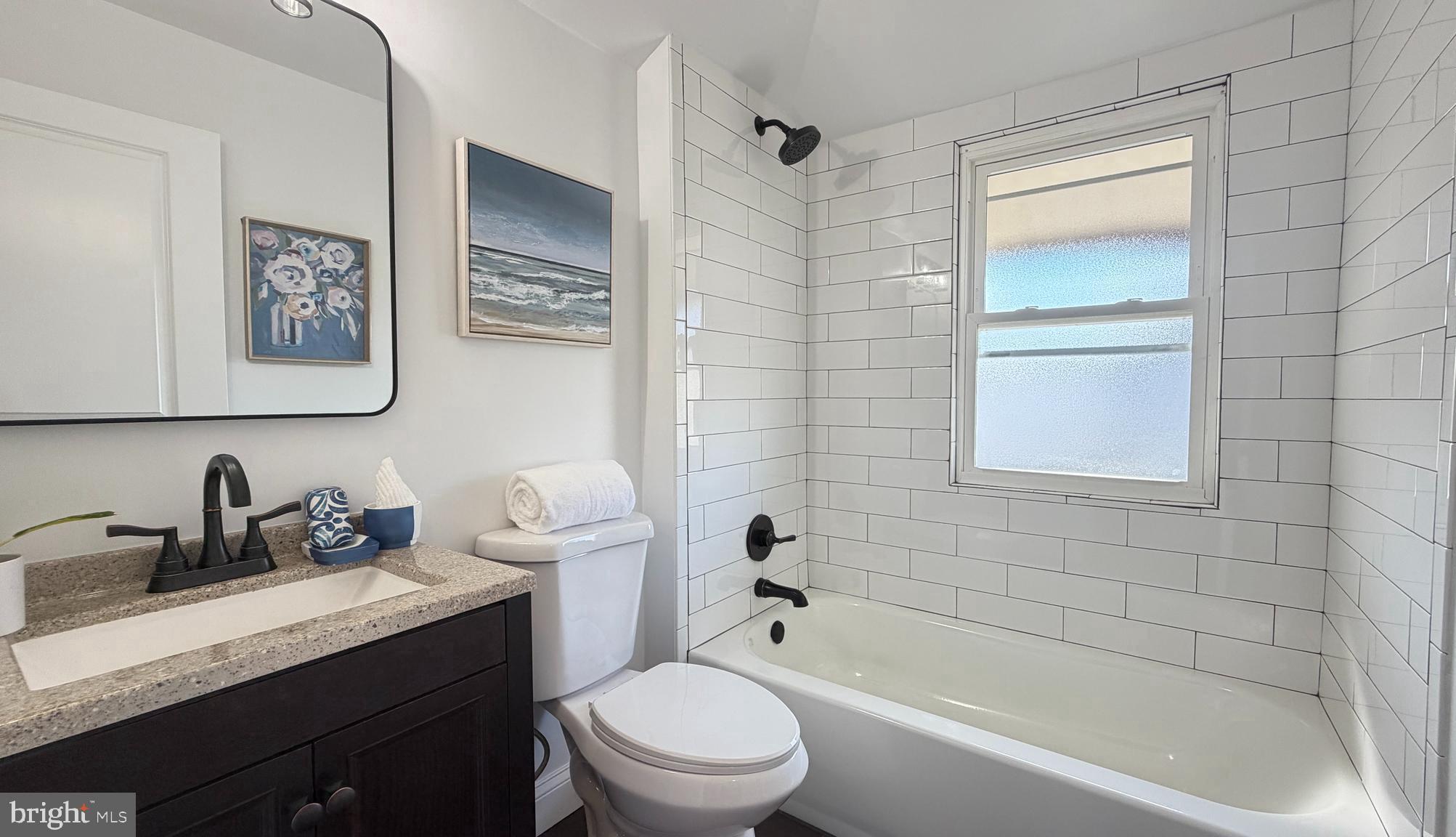718 Bordentown Road Burlington, NJ 08016 - Photo 21 of 30 a bathroom with a granite countertop sink a toilet and shower