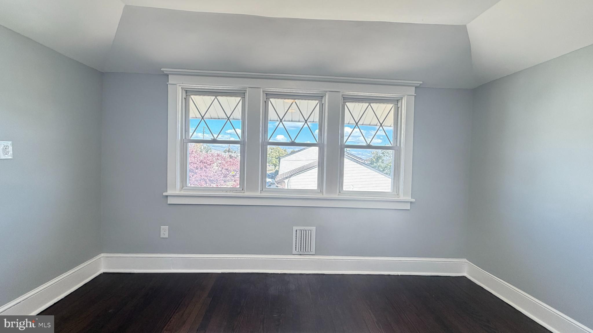 718 Bordentown Road Burlington, NJ 08016 - Photo 23 of 30 an empty room with wooden floor and windows