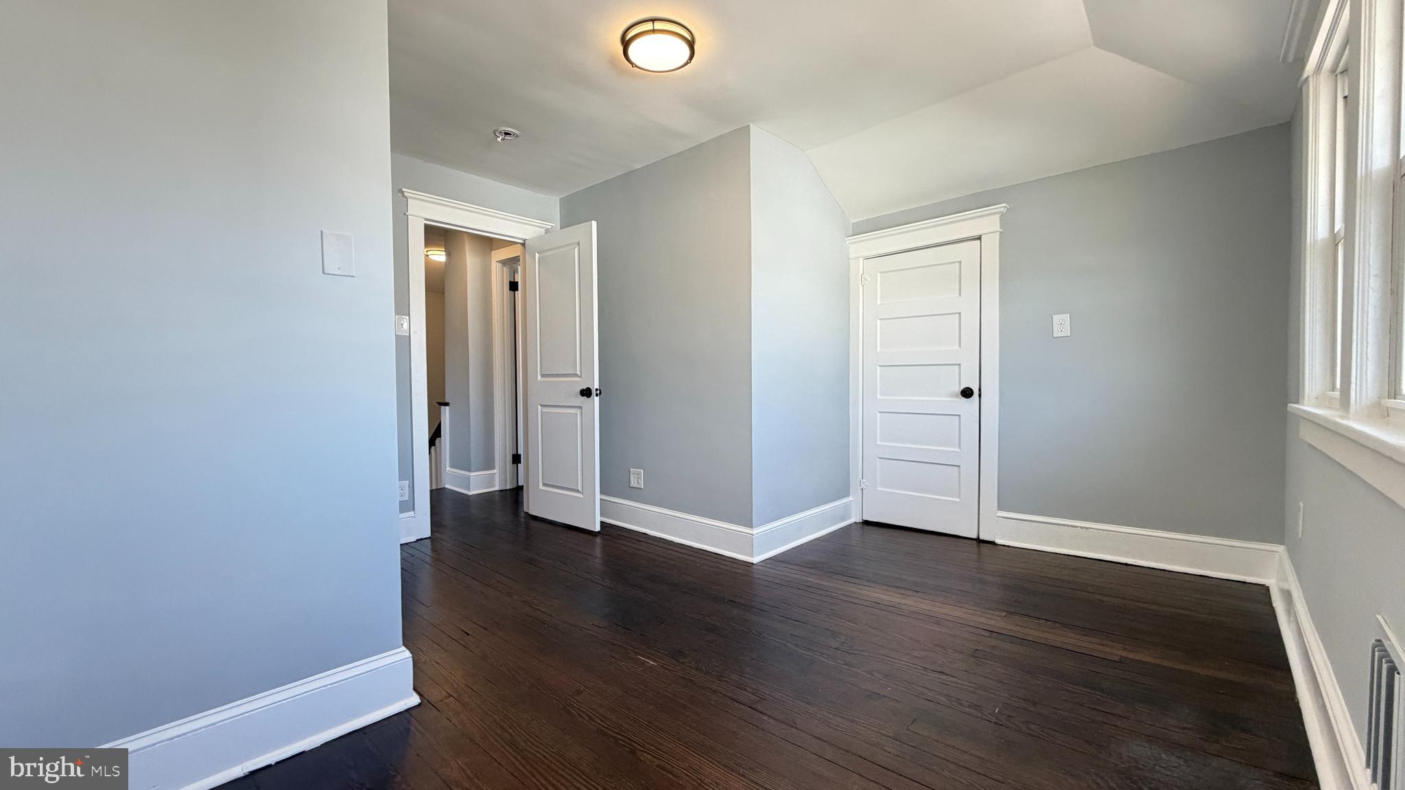 718 Bordentown Road Burlington, NJ 08016 - Photo 24 of 30 an empty room with wooden floor and windows