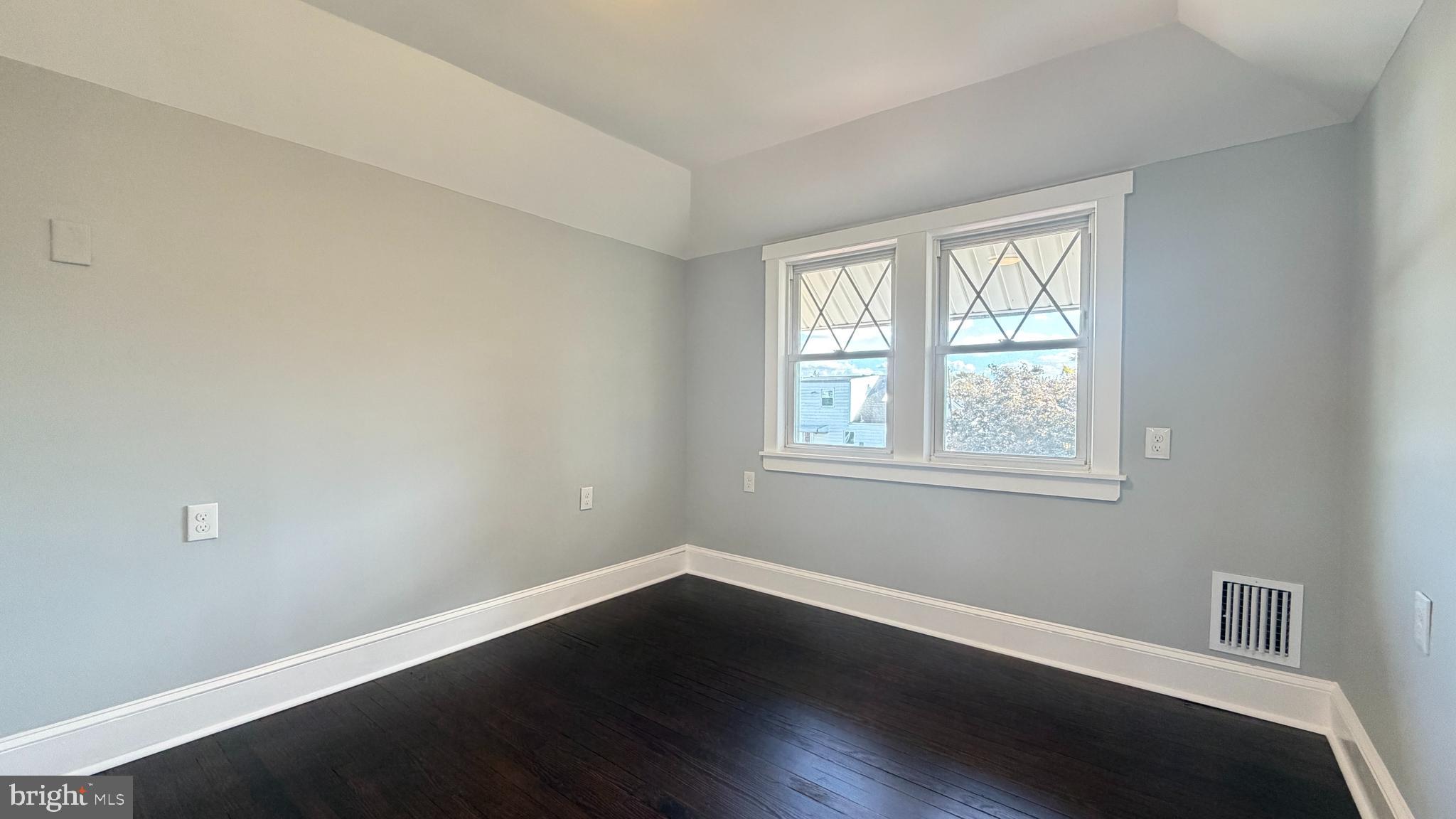 718 Bordentown Road Burlington, NJ 08016 - Photo 27 of 30 an empty room with wooden floor and windows