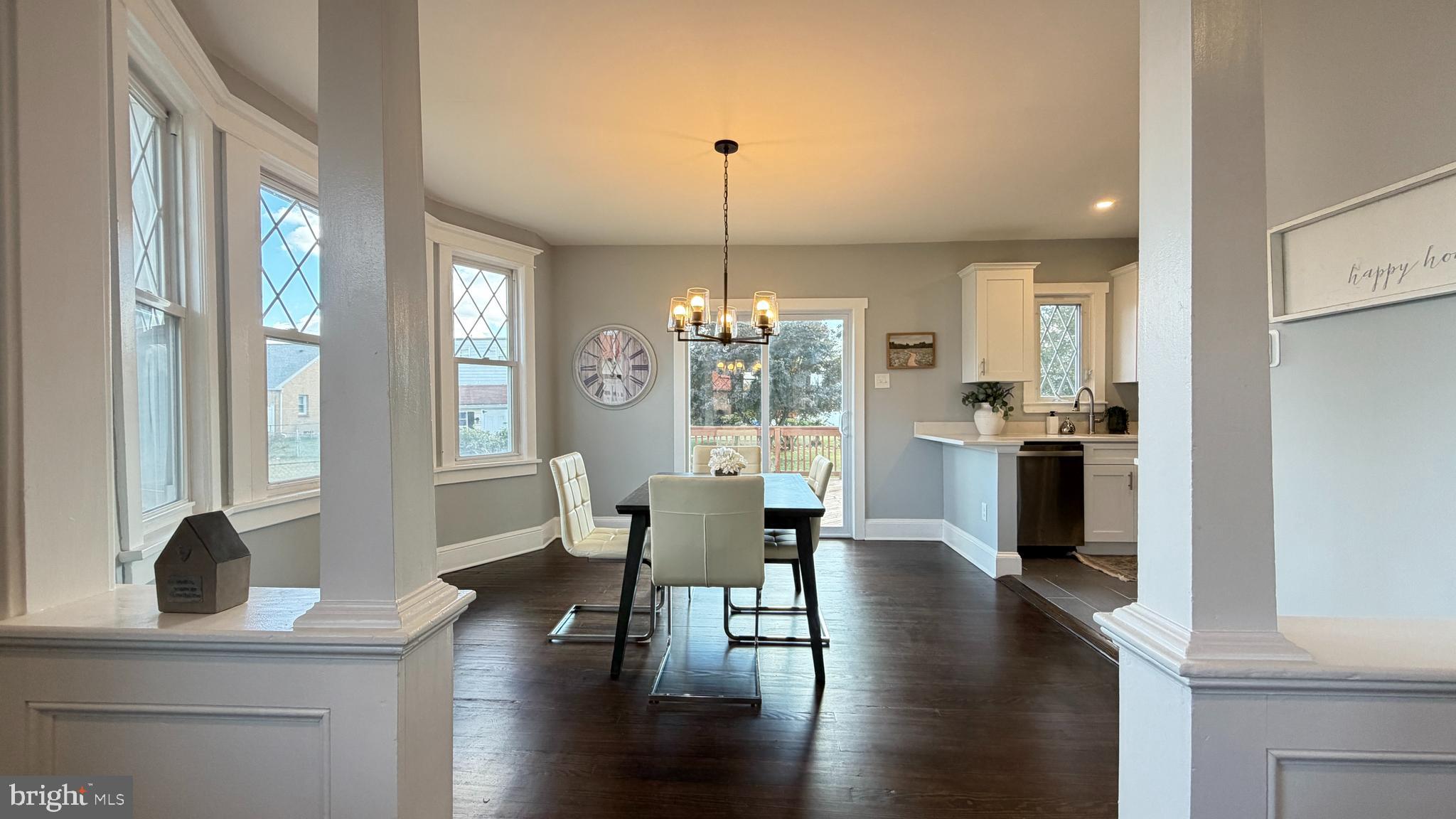 718 Bordentown Road Burlington, NJ 08016 - Photo 8 of 30 a living room with couches chairs and kitchen view with wooden floor