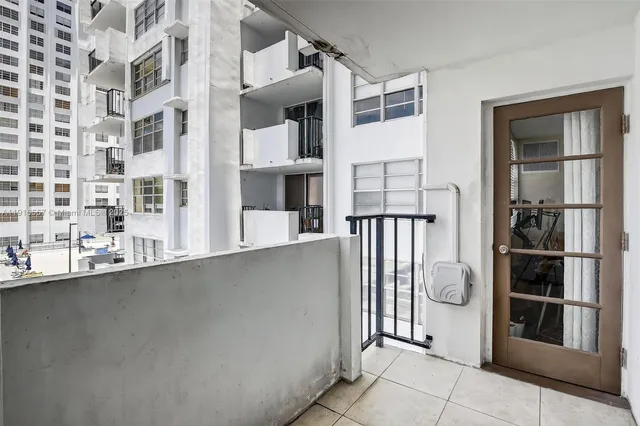 a view of a balcony with washer and dryer