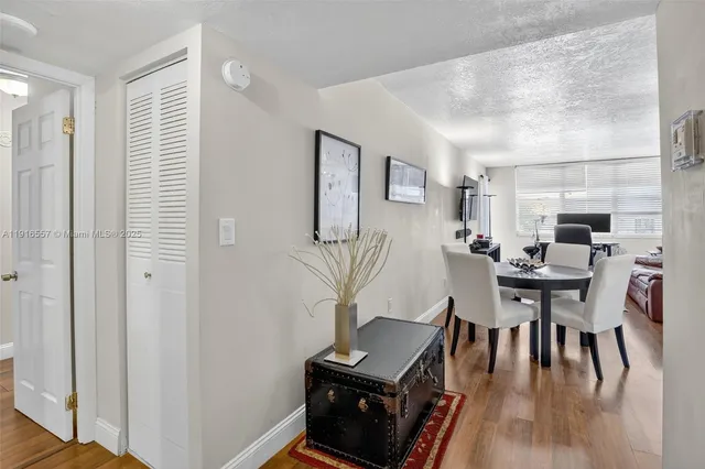 a view of a dining room with furniture and wooden floor