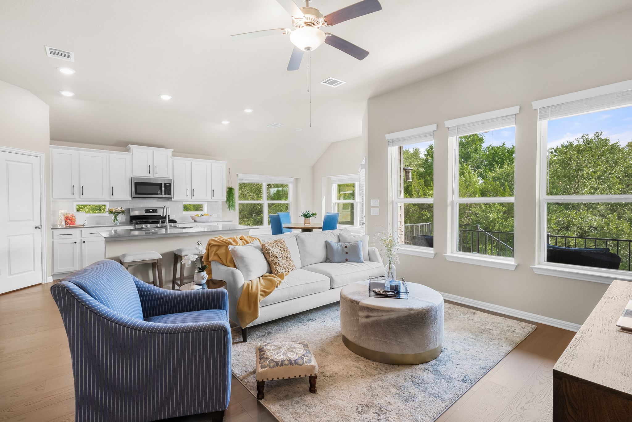 300 Prato Place Georgetown, TX 78628 - Photo 15 of 40 An open concept living area boasts rich wood flooring and ample natural light.