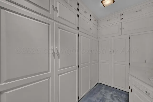 a bathroom with a granite countertop sink a mirror and a shower