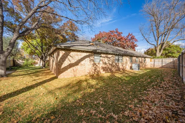 a view of street with large trees
