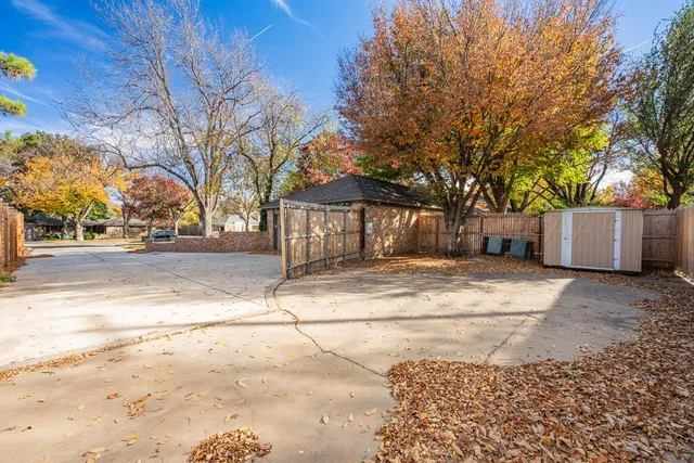 a swimming pool with outdoor seating and yard