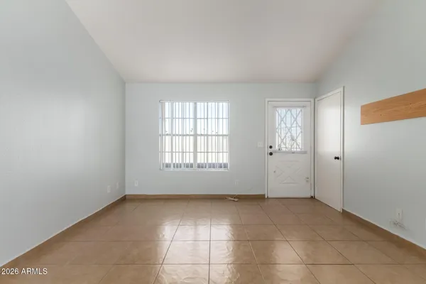 a kitchen with white cabinets stainless steel appliances and sink