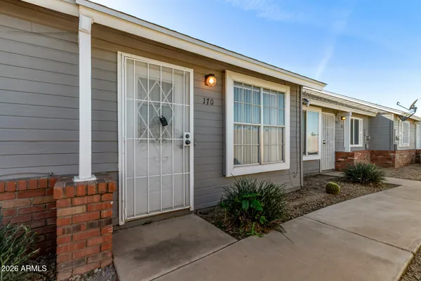 a front view of a house with a large window