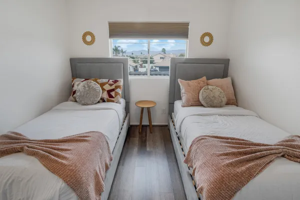 a bedroom with a bed and window