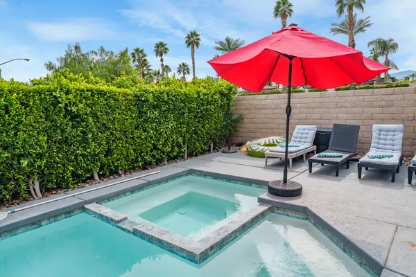 a view of a backyard with sitting area and sitting area