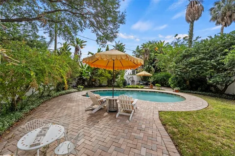 a view of a swimming pool with lounge chair