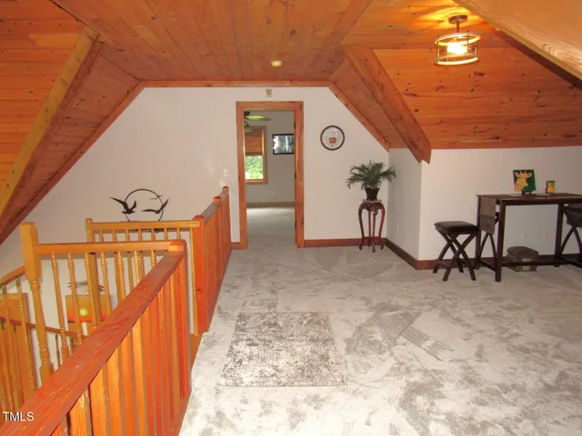 a view of a hallway with seating area