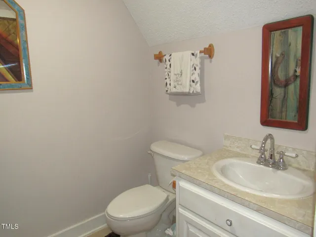 a bathroom with a shower curtain and a sink
