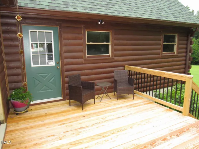 a view of a balcony with wooden floor