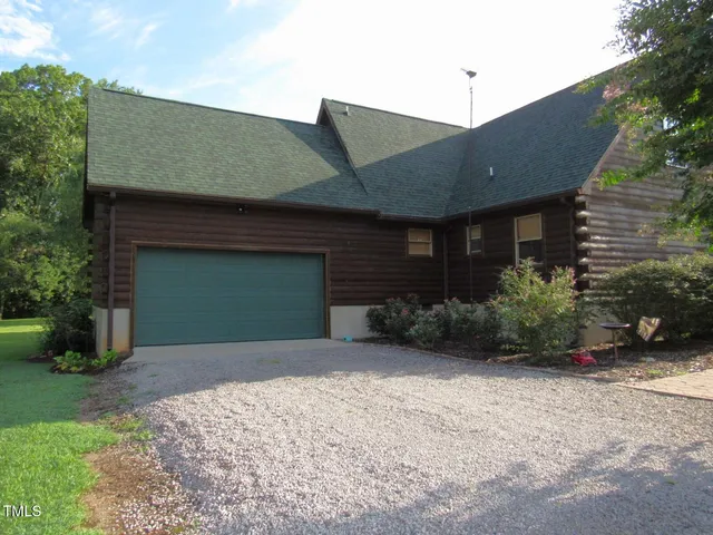 a view of a chair and tables in the balcony