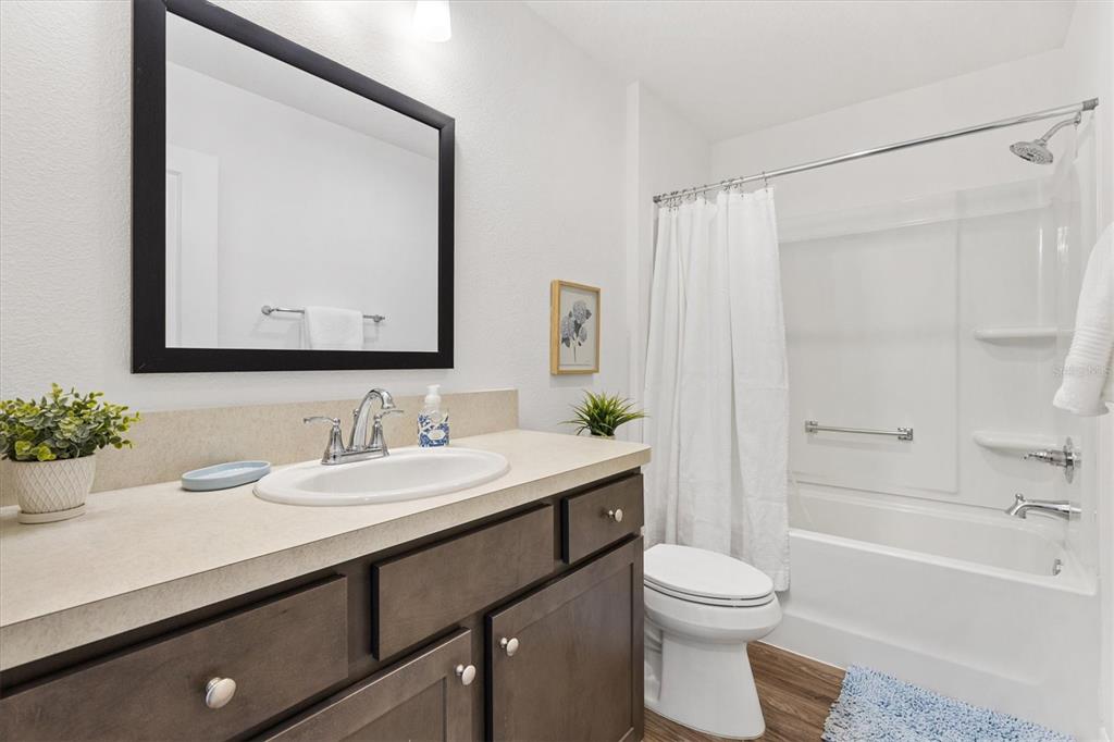6767 Mary Loop The Villages, FL 34762 - Photo 15 of 26 a bathroom with a sink a toilet and shower
