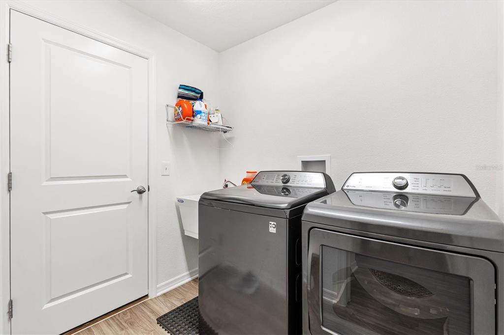 6767 Mary Loop The Villages, FL 34762 - Photo 18 of 26 a utility room with dryer and washer