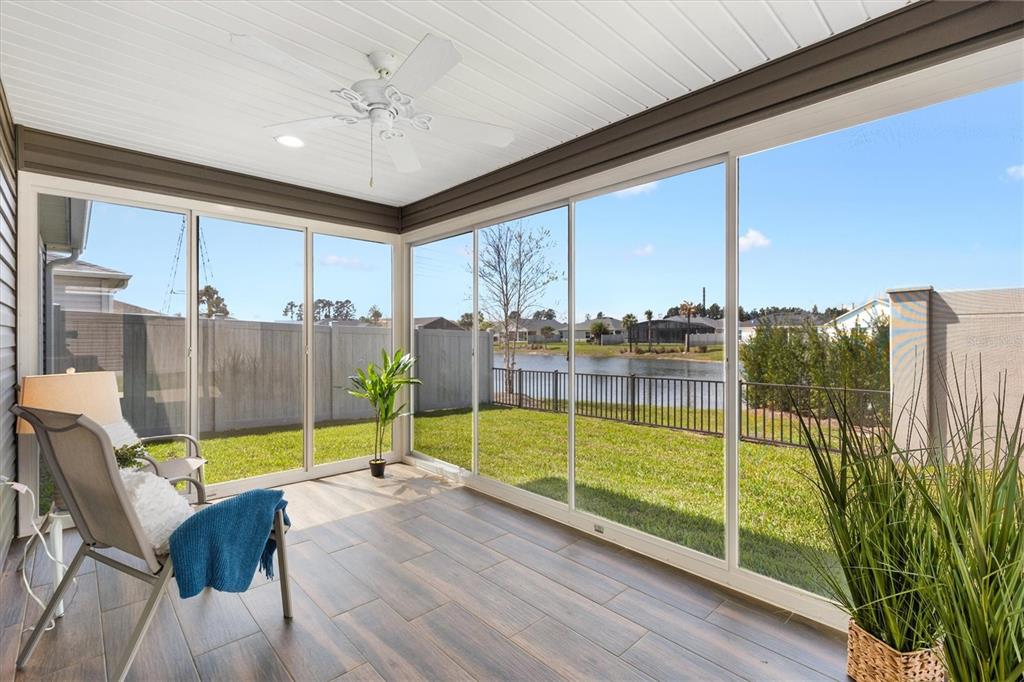 6767 Mary Loop The Villages, FL 34762 - Photo 19 of 26 a view of a living room and a balcony