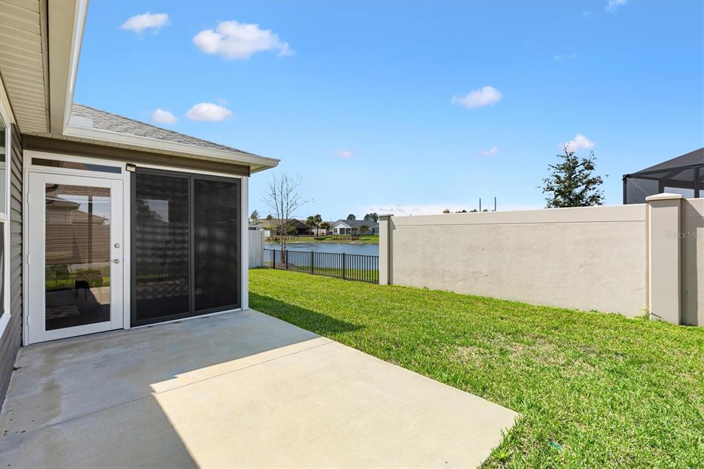 6767 Mary Loop The Villages, FL 34762 - Photo 21 of 26 a view of a backyard with potted plants