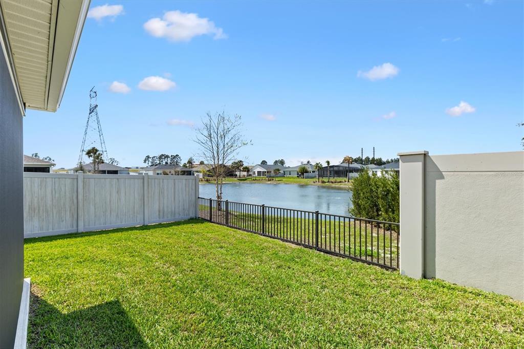 6767 Mary Loop The Villages, FL 34762 - Photo 22 of 26 a view of a backyard