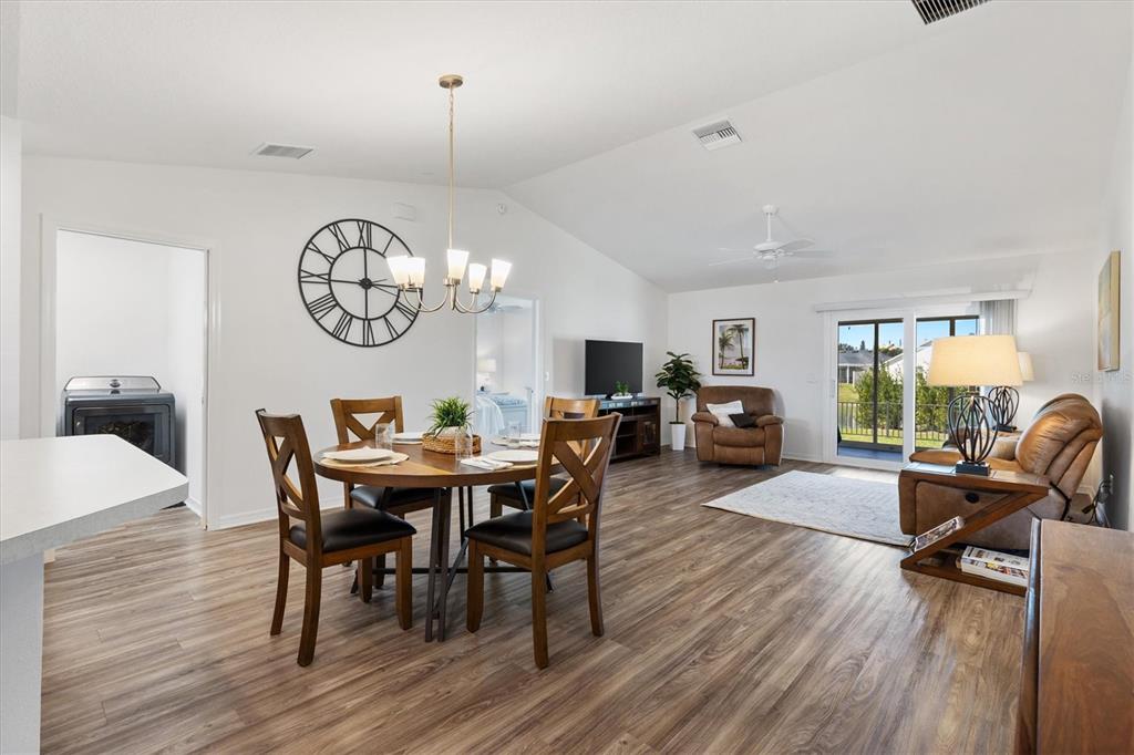 6767 Mary Loop The Villages, FL 34762 - Photo 3 of 26 a view of a dining room with furniture window and wooden floor