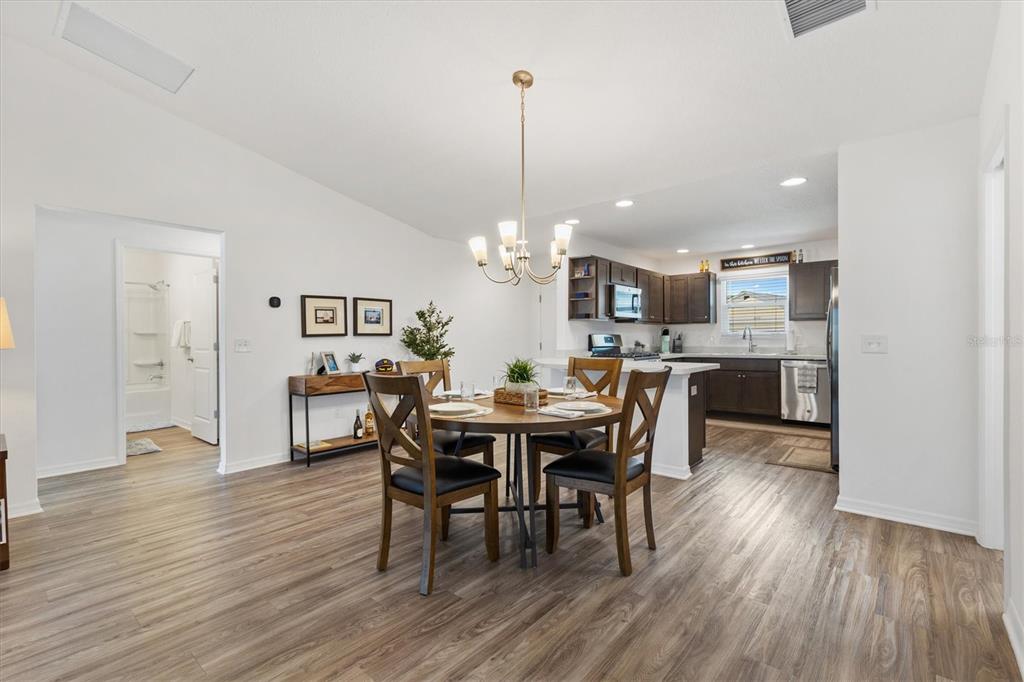 6767 Mary Loop The Villages, FL 34762 - Photo 5 of 26 a view of a dining room with furniture window and wooden floor