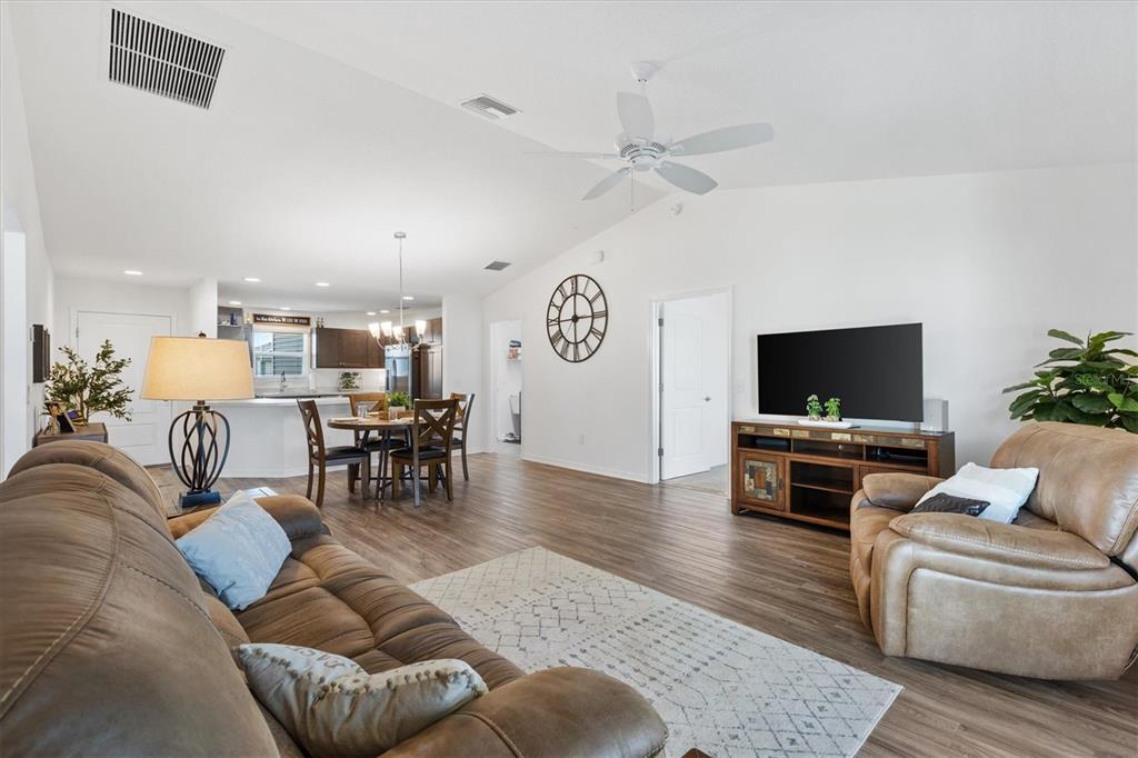 6767 Mary Loop The Villages, FL 34762 - Photo 9 of 26 a living room with furniture and a flat screen tv