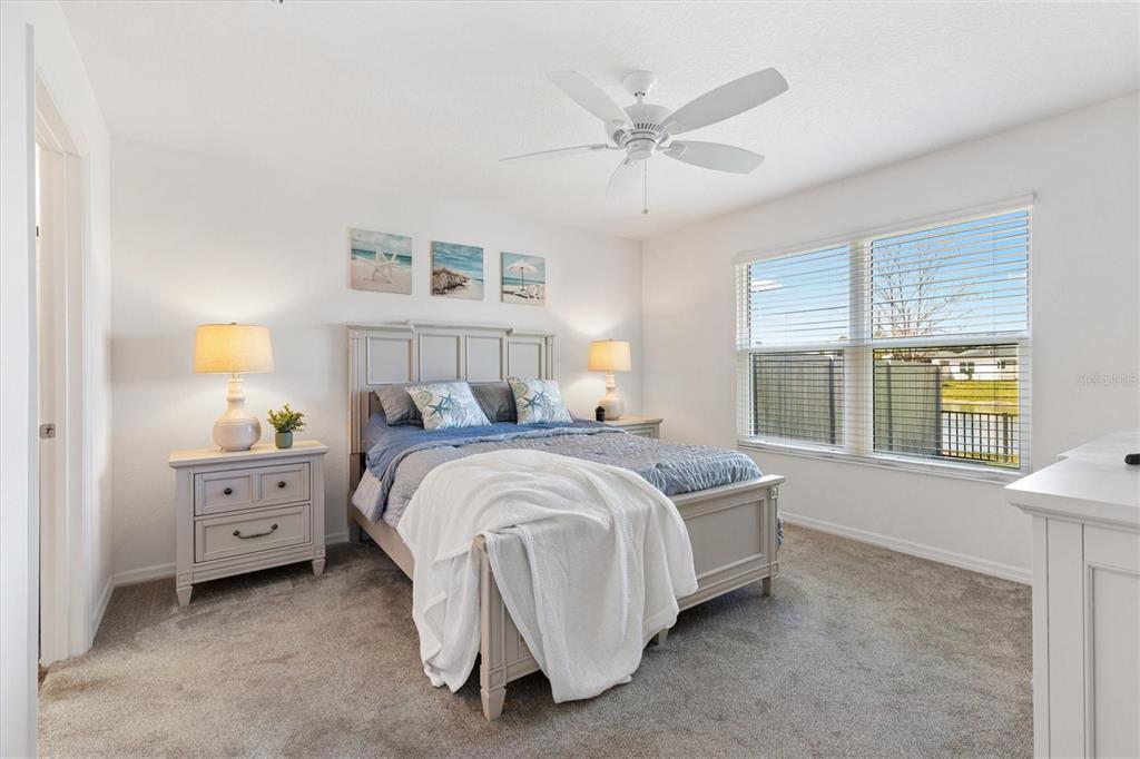 6767 Mary Loop The Villages, FL 34762 - Photo 10 of 26 a spacious bedroom with a bed and a window