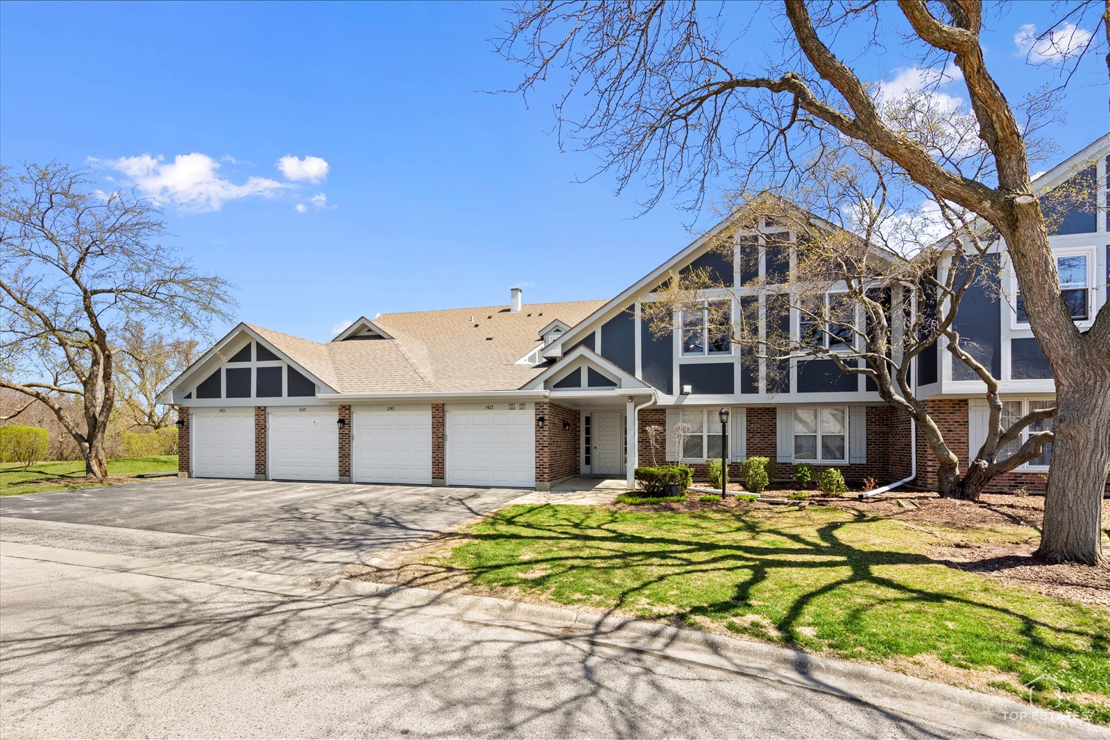 1427 Sutton Court, Unit 1427 Vernon Hills, IL 60061 - Photo 1 of 27 a front view of a house with a yard